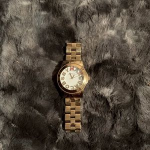 Gold Marc Jacobs watch with colored stones